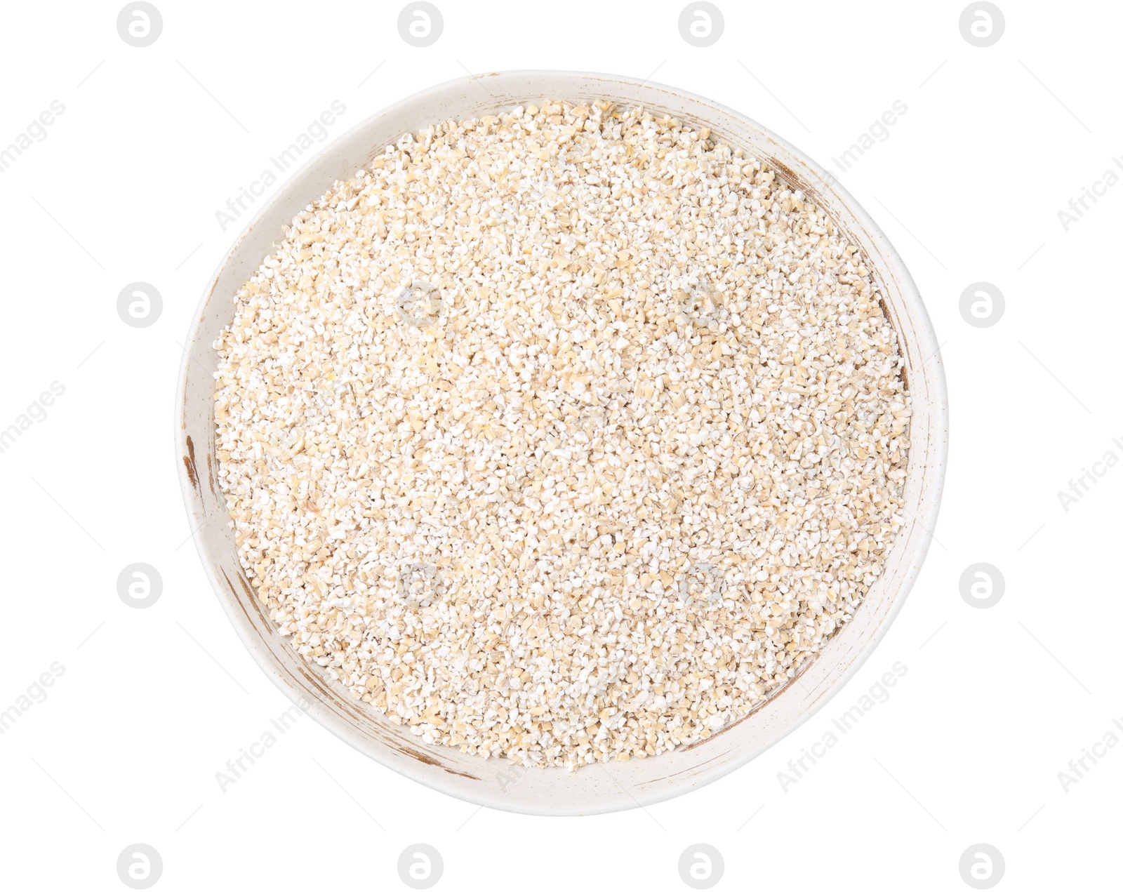 Photo of Dry barley groats in bowl isolated on white, top view