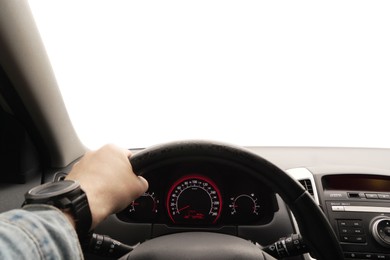 Photo of Man driving car with speedometer on dashboard, closeup