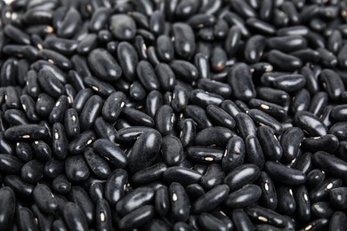 Photo of Heap of black beans as background, closeup. Veggie seeds