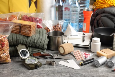 Photo of Disaster supply kit for earthquake on grey table