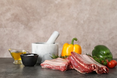 Photo of Composition with raw meat on table. Space for text