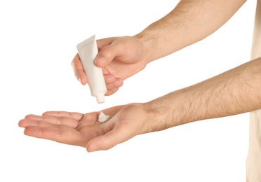 Photo of Man applying cream onto hand against white background, closeup