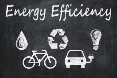 Image of Energy efficiency concept. Different icons drawn on blackboard