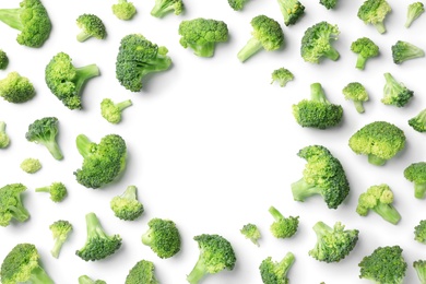 Photo of Flat lay composition with fresh green broccoli on light background