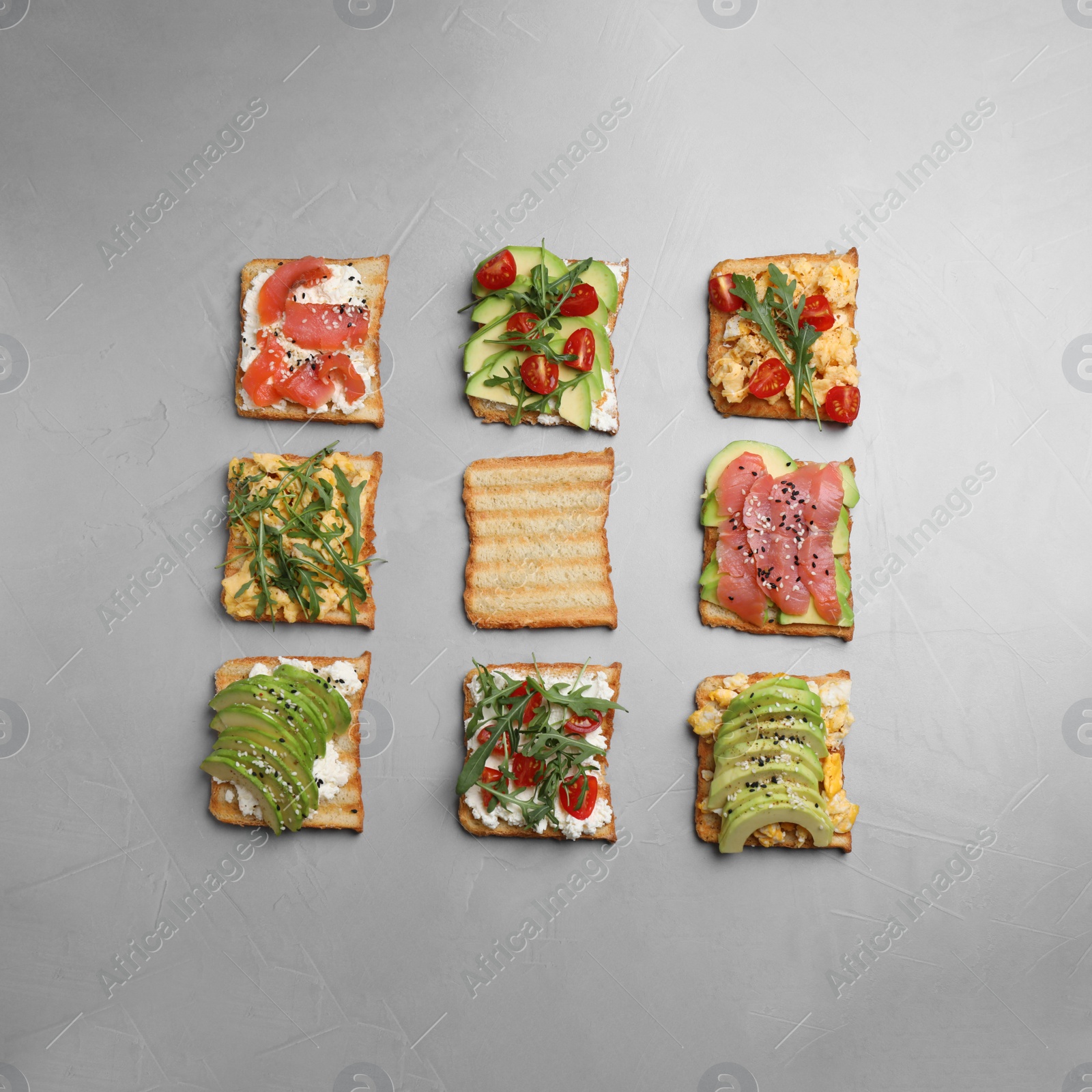 Photo of Set of different sandwiches on light grey table, flat lay