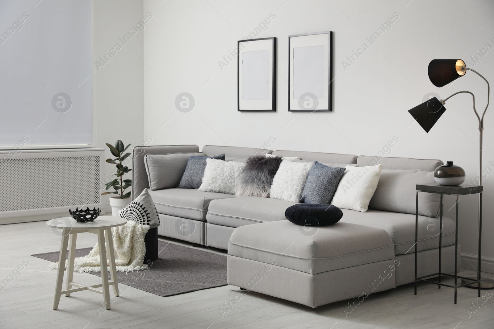 Photo of Stylish living room interior with comfortable sofa