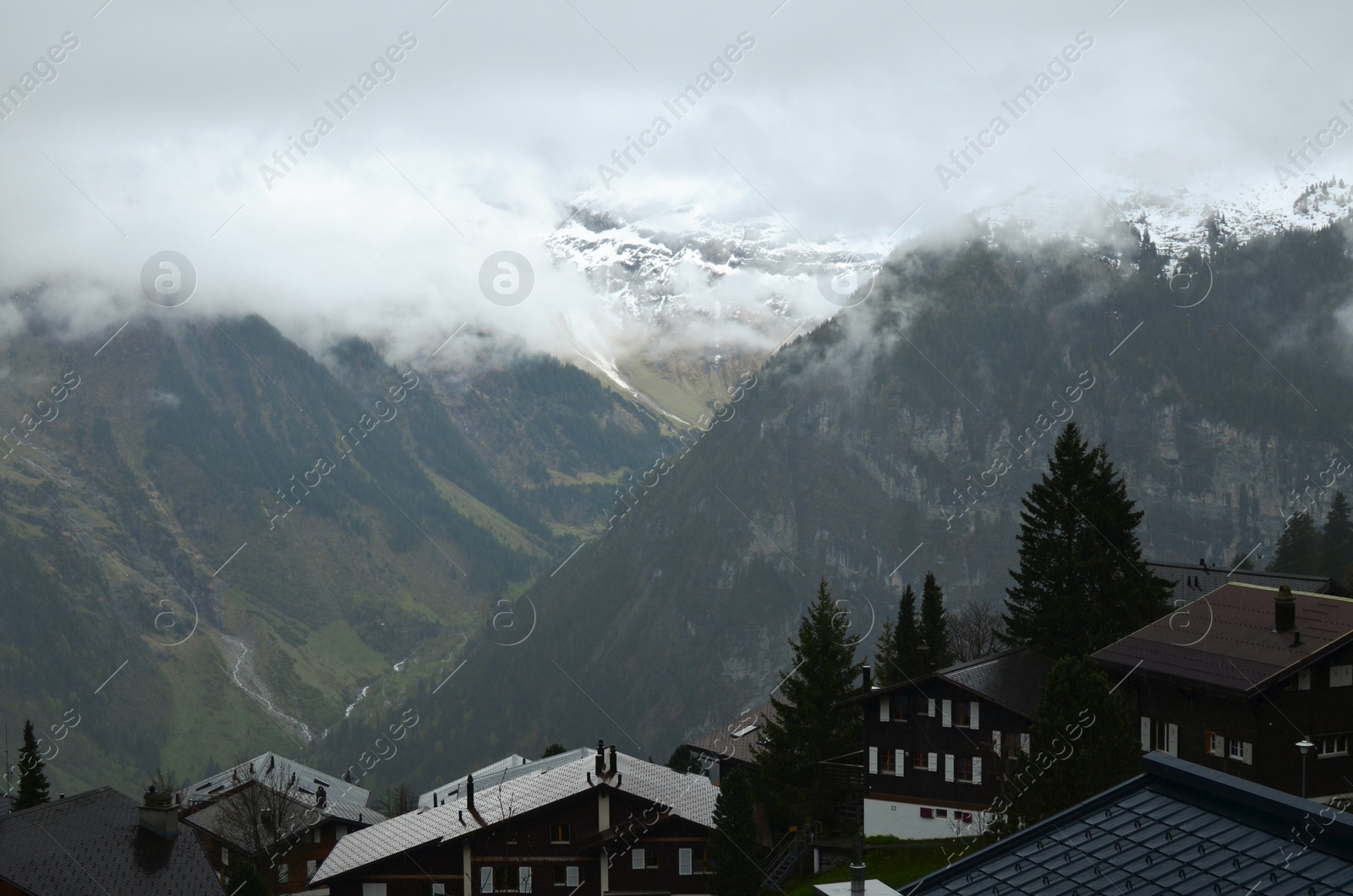 Photo of Picturesque view on cottage village and mountains