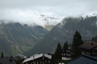 Picturesque view on cottage village and mountains