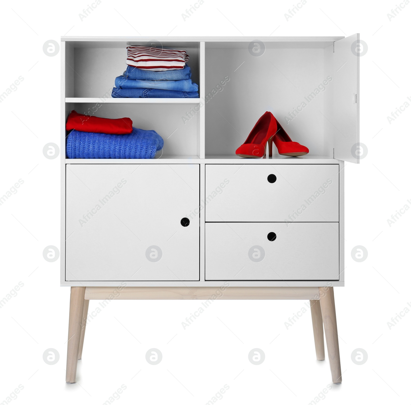 Photo of Stylish dresser with clothes and shoes on white background. Furniture for wardrobe room