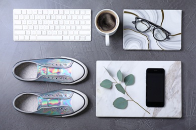 Photo of Flat lay composition with keyboard and fashion blogger's stuff on stone surface