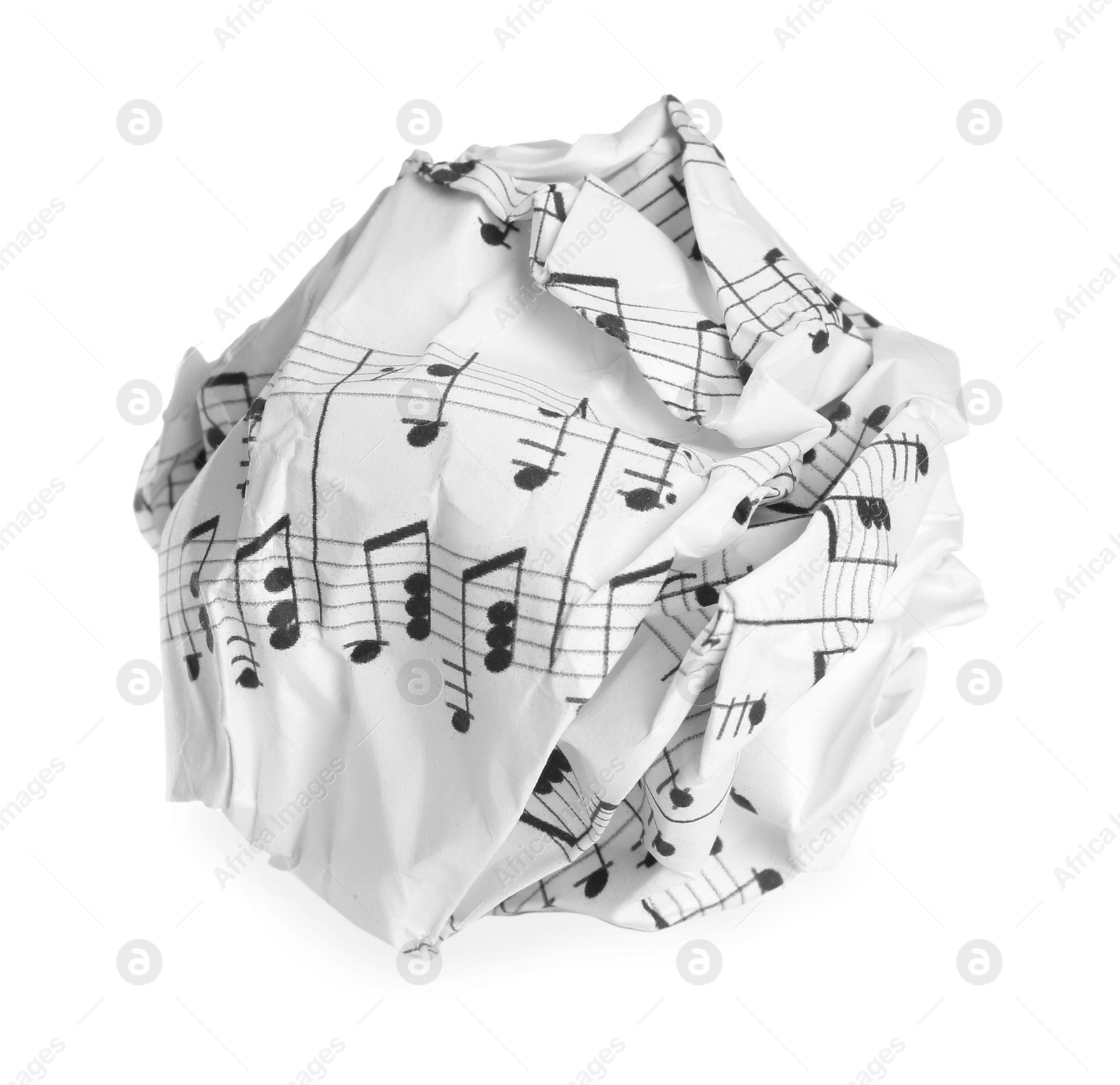 Photo of Crumpled sheet of paper with musical notes isolated on white