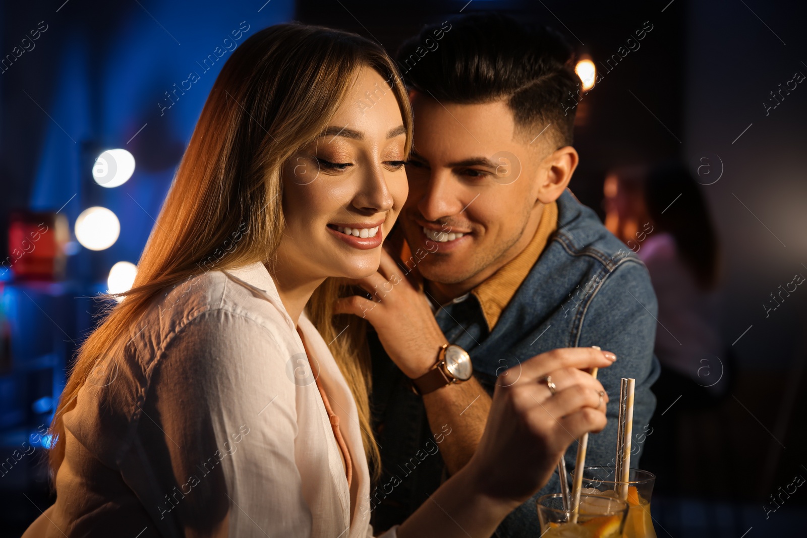 Photo of Man and woman flirting with each other in bar