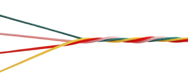 Photo of Twisted colorful ropes on white background. Unity concept