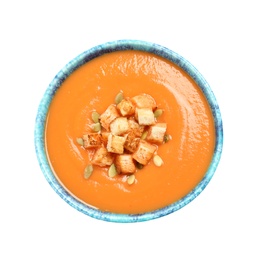 Photo of Tasty creamy pumpkin soup with croutons and seeds in bowl on white background, top view