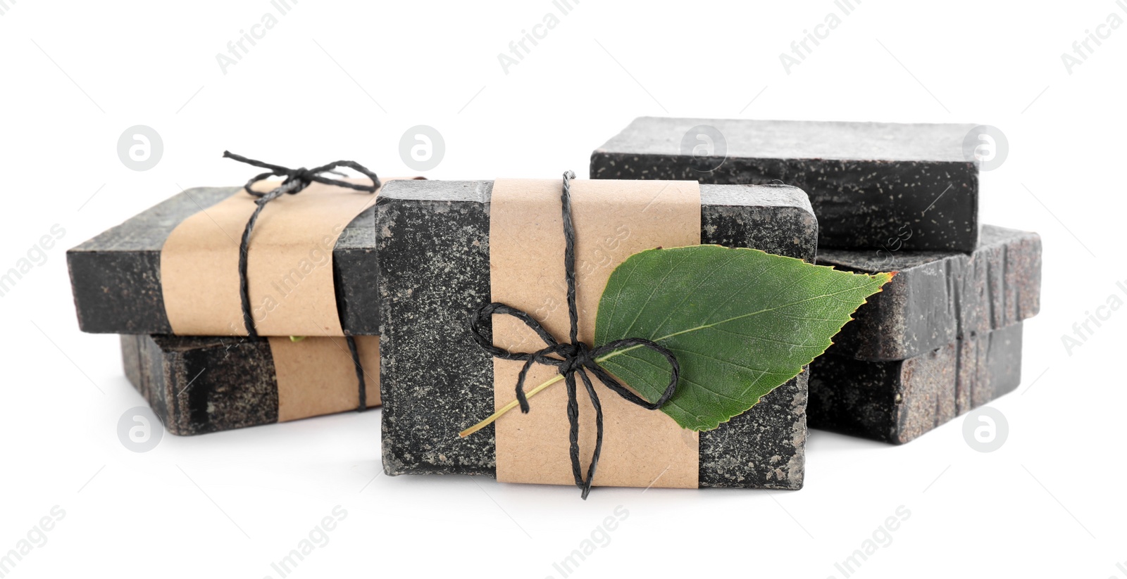 Photo of Tar soap bars isolated on white. Natural product