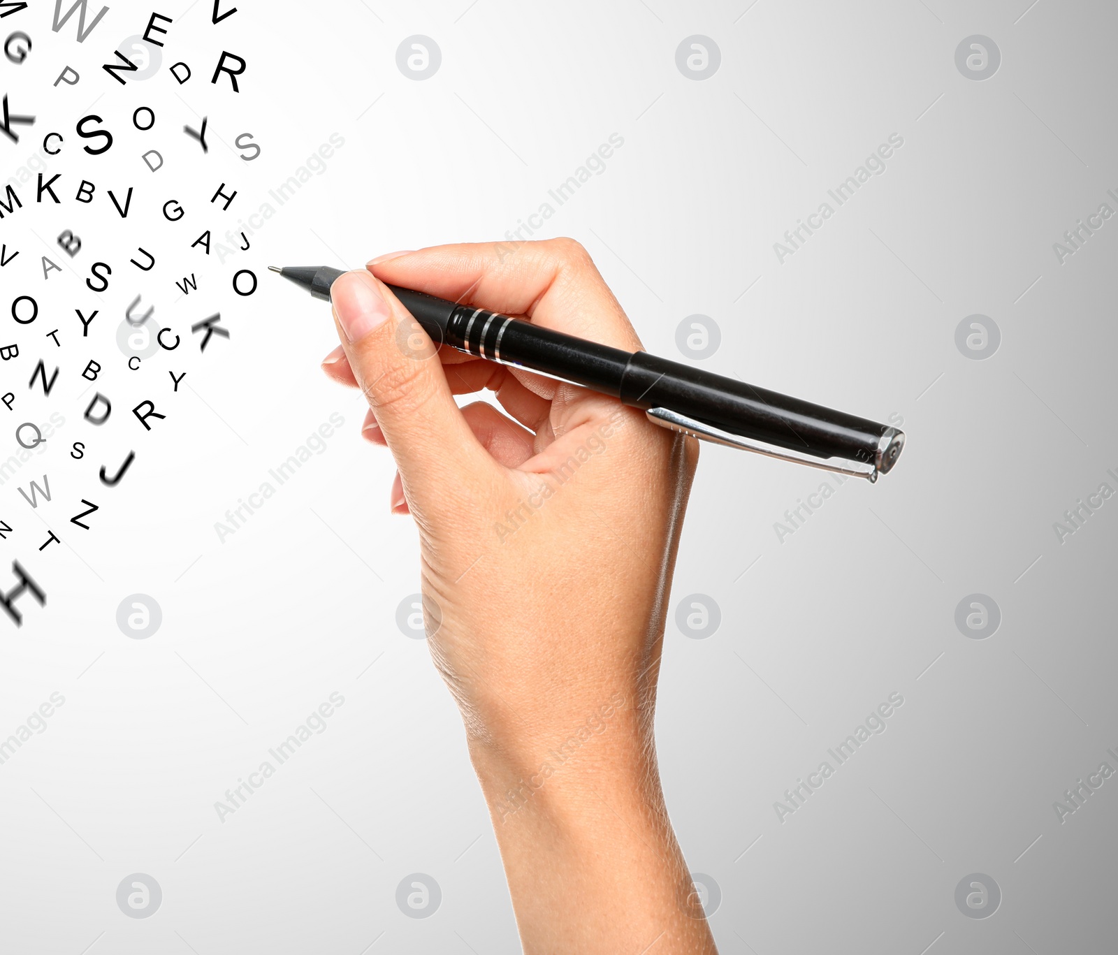 Image of Woman writing letters and they flying away on grey gradient background, closeup