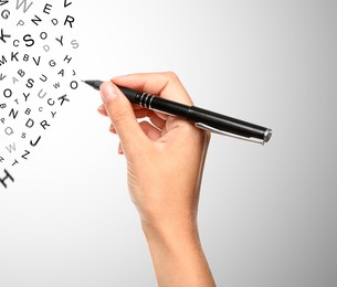 Image of Woman writing letters and they flying away on grey gradient background, closeup