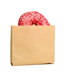 Photo of Paper bag with donut on white background. Space for design