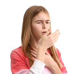 Teenage girl suffering from cough isolated on white