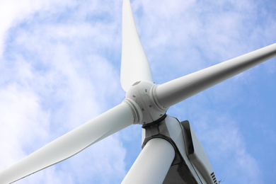 Photo of Wind turbine against beautiful sky, closeup. Alternative energy source