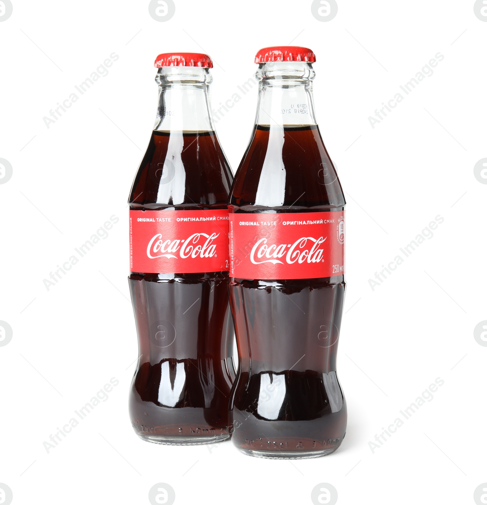 Photo of MYKOLAIV, UKRAINE - NOVEMBER 14, 2018: Bottles of Coca-Cola on white background