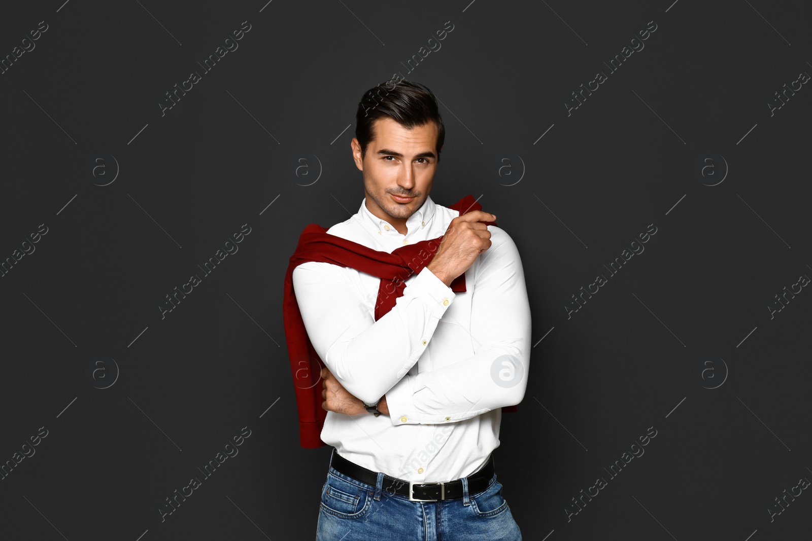 Photo of Portrait of handsome young man on dark background