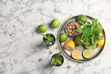 Flat lay composition with delicious mint julep cocktail on marble background