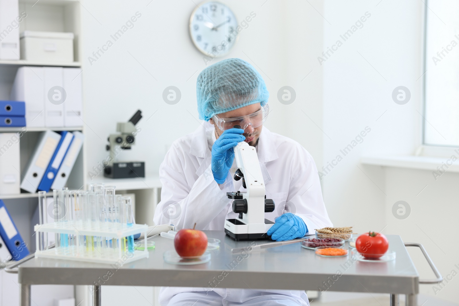 Photo of Quality control. Food inspector checking safety of products in laboratory