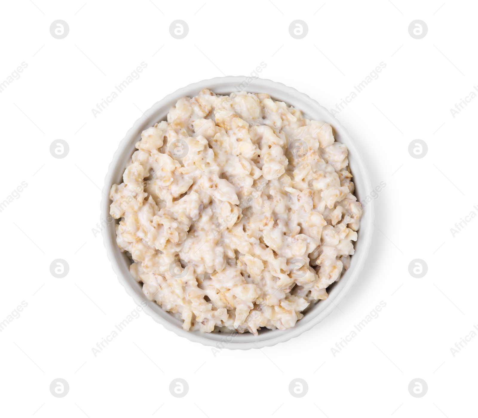 Photo of Ceramic bowl with oatmeal isolated on white, top view
