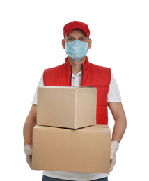 Photo of Courier in protective mask and gloves holding cardboard boxes on white background. Delivery service during coronavirus quarantine