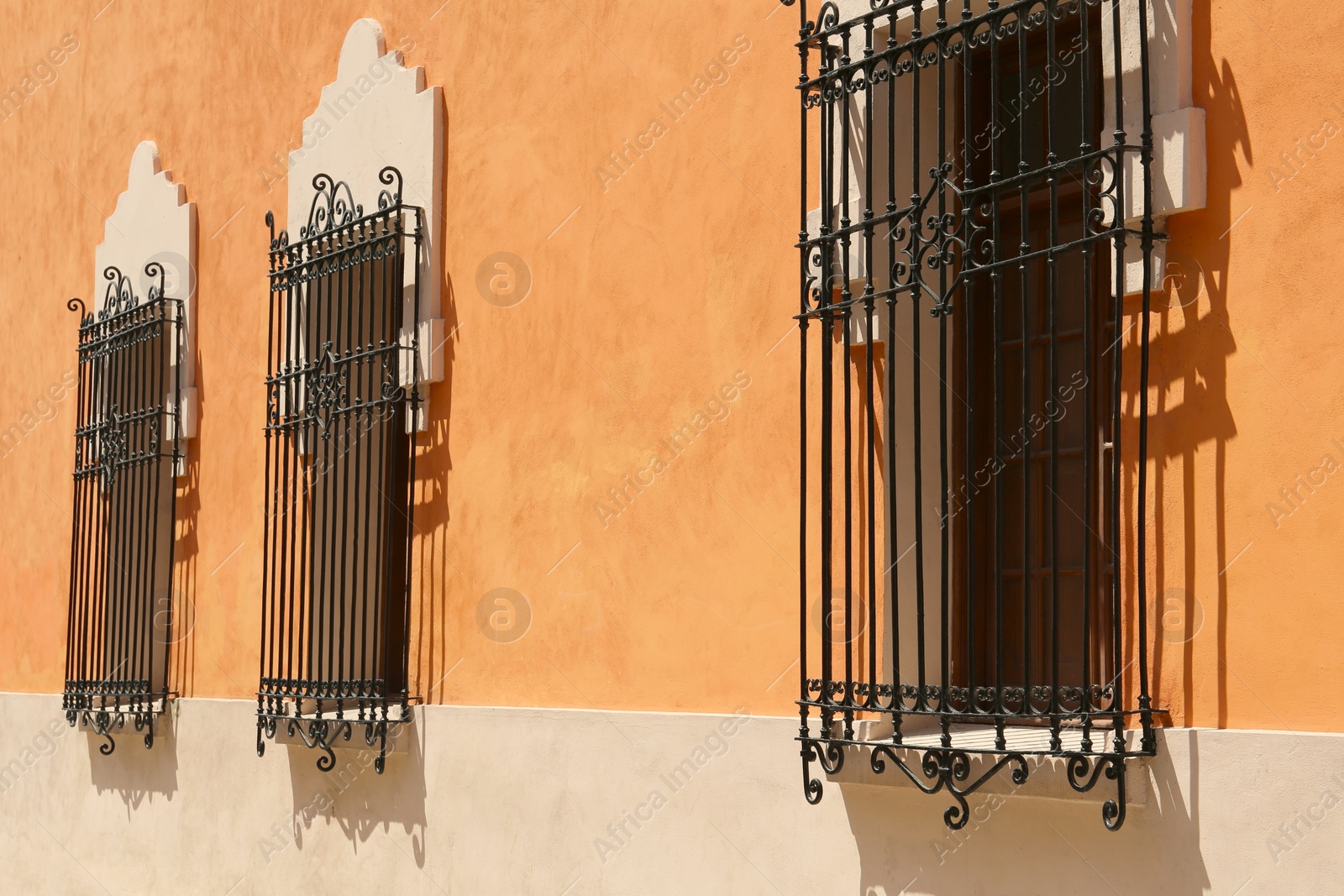 Photo of Exterior of building with beautiful windows and steel grilles