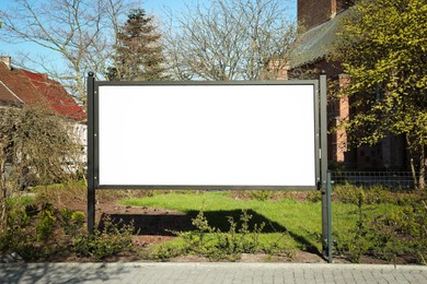 Image of Empty signboard outdoors on sunny day. Mock-up for design