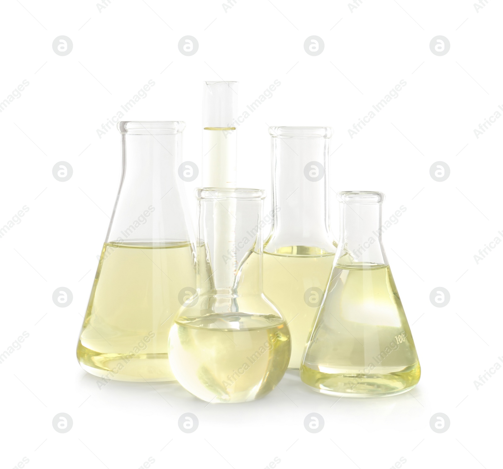 Photo of Laboratory glassware with liquid on white background. Chemical analysis