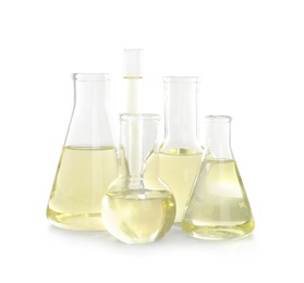 Laboratory glassware with liquid on white background. Chemical analysis