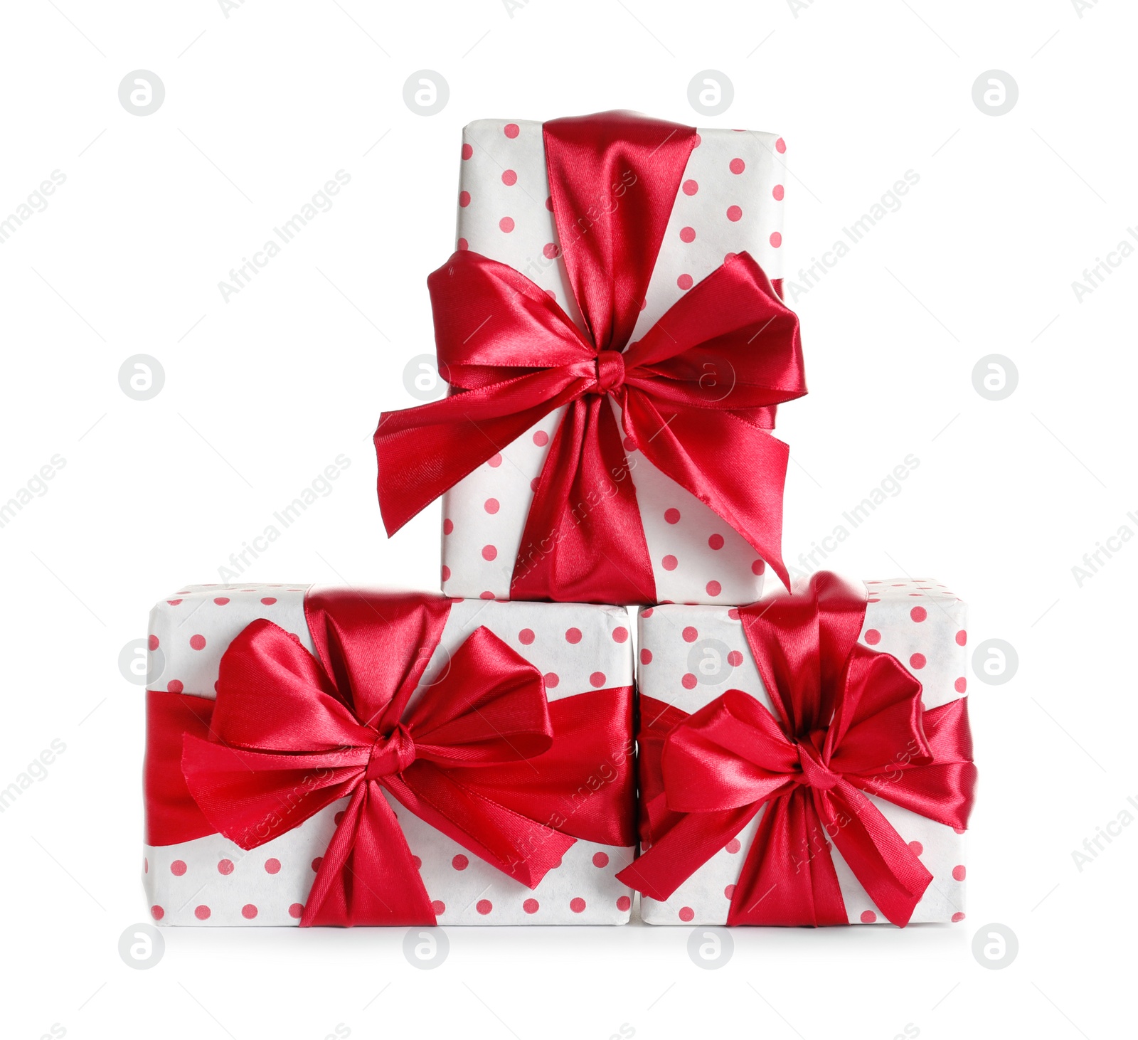 Photo of Beautifully wrapped gift boxes on white background