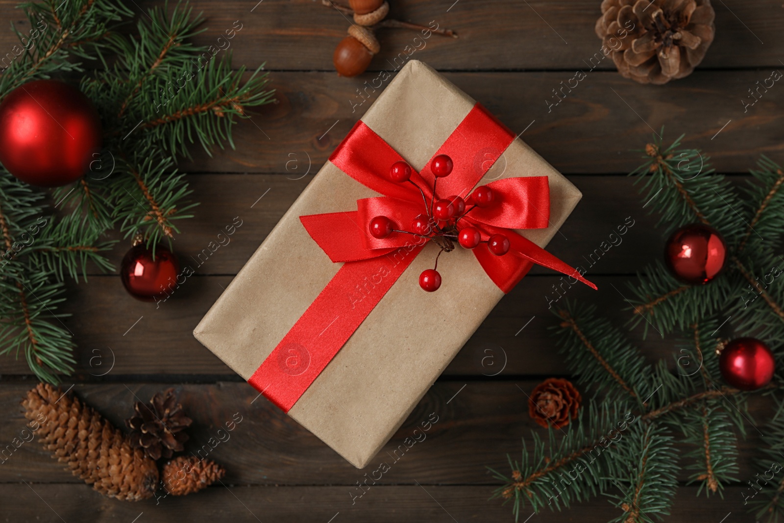 Photo of Flat lay composition with Christmas gift box on wooden table