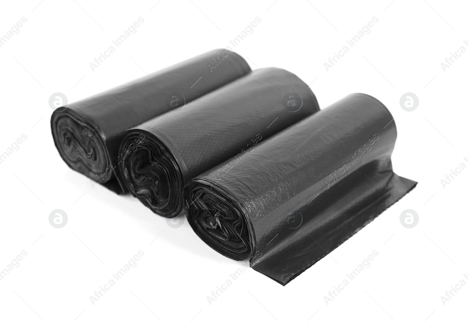 Photo of Rolls of black garbage bags isolated on white