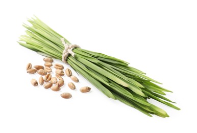 Photo of Sprouts of wheat grass and seeds isolated on white