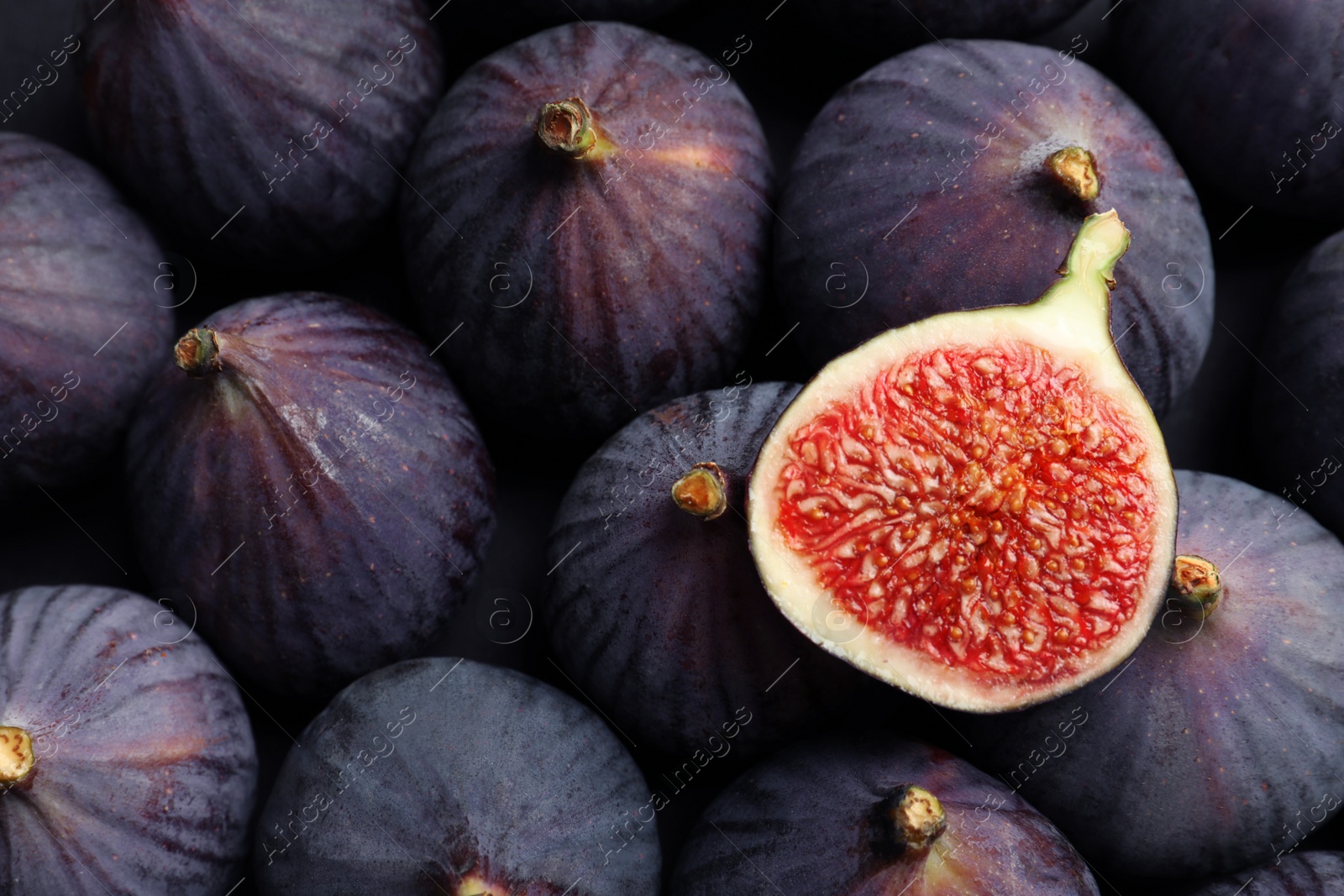 Photo of Fresh ripe figs as background, top view. Tropical fruit