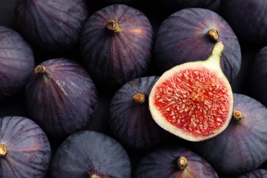 Photo of Fresh ripe figs as background, top view. Tropical fruit