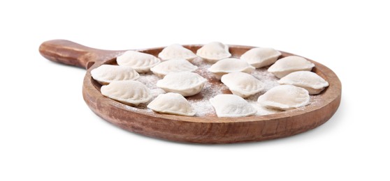 Raw dumplings (varenyky) with tasty filling and flour on white background
