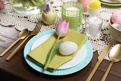 Photo of Festive table setting with beautiful tulip, closeup. Easter celebration