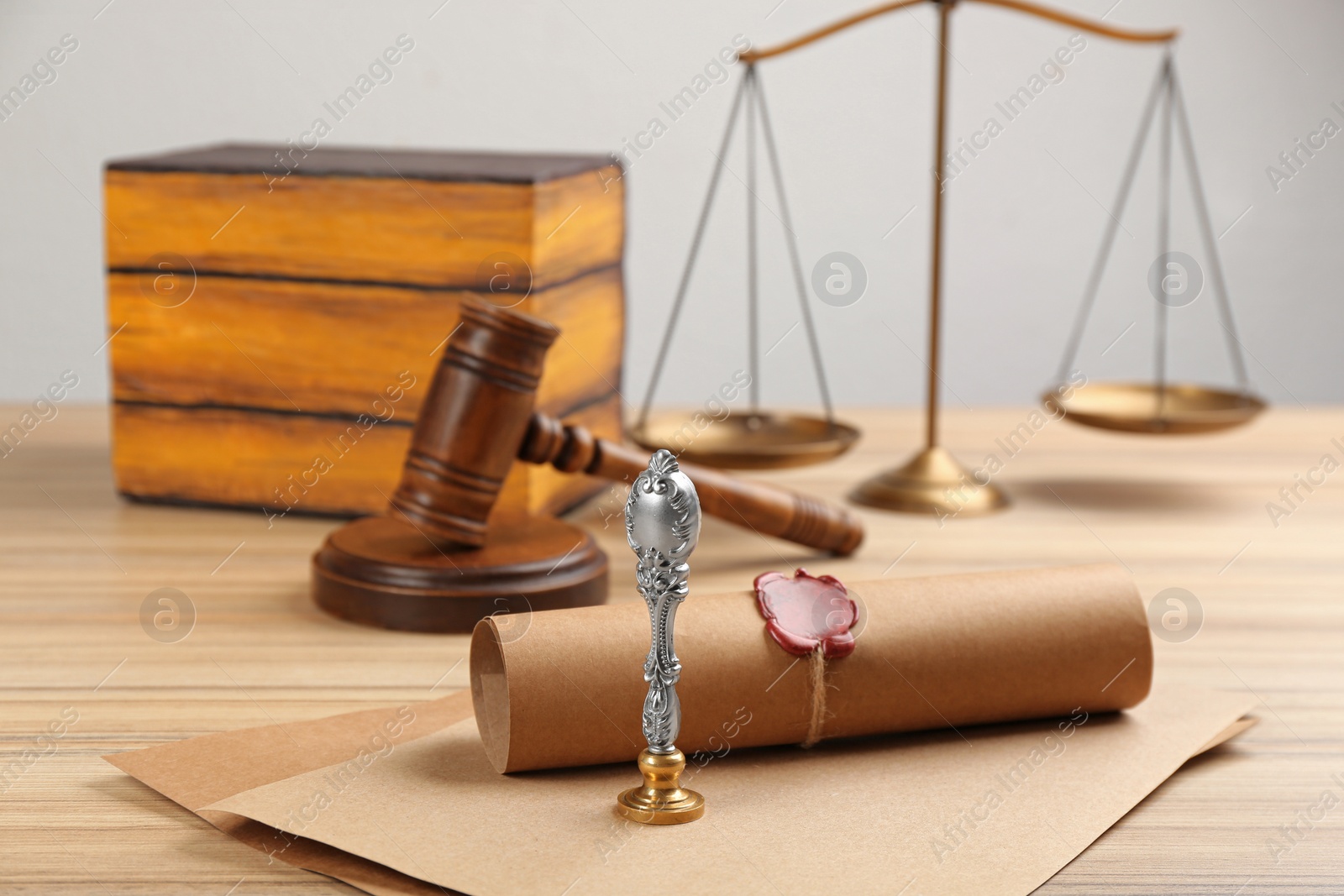 Photo of Notary's public pen and sealed document on wooden table