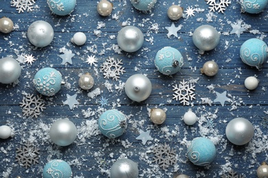 Flat lay composition with Christmas decorations on blue wooden background. Winter season