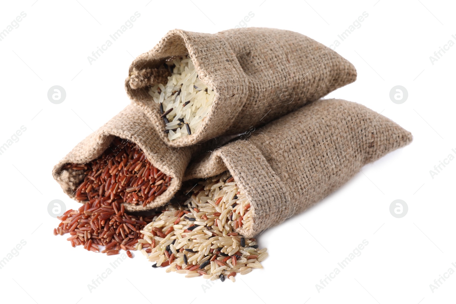 Photo of Brown and polished rice in bags isolated on white