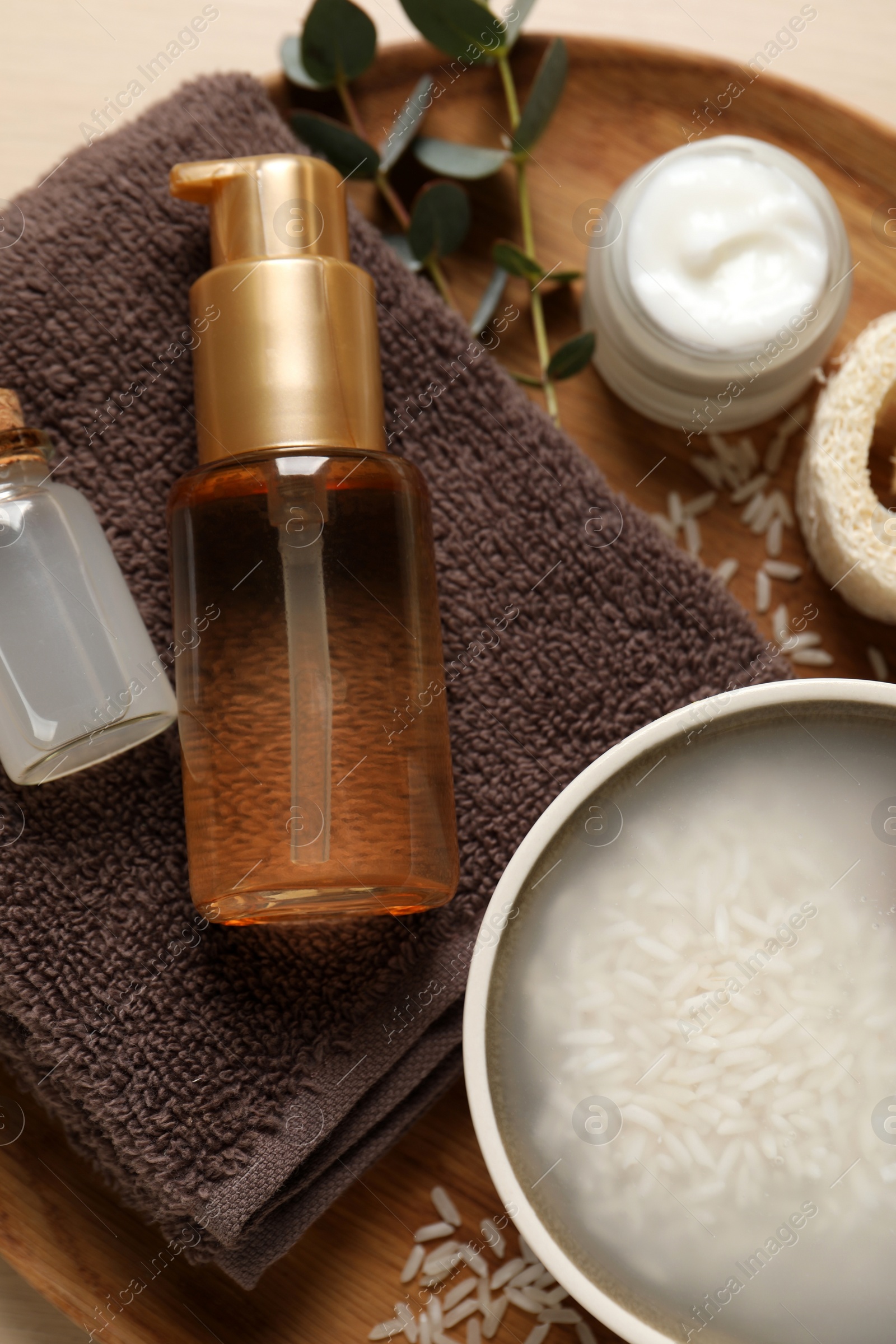 Photo of Flat lay composition with soaked rice on wooden tray