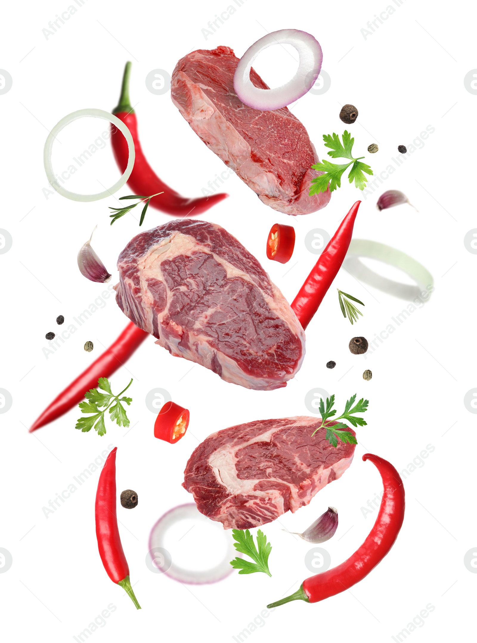 Image of Beef meat and different spices falling on white background