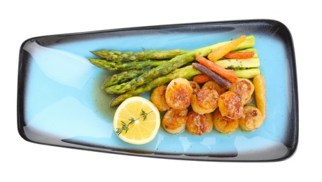Photo of Delicious fried scallops with asparagus, vegetables, lemon and thyme isolated on white, top view