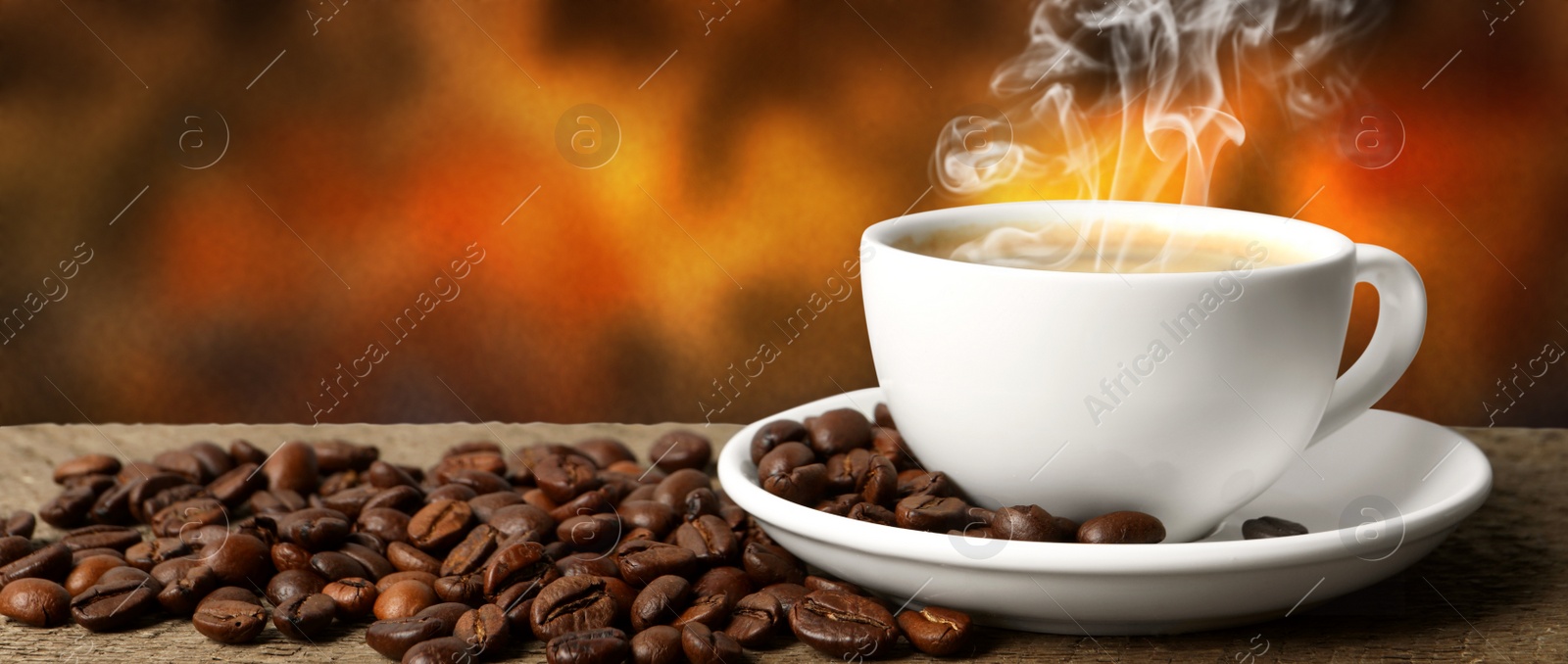 Image of Cup of hot aromatic coffee and roasted beans on wooden table against color background. Banner design
