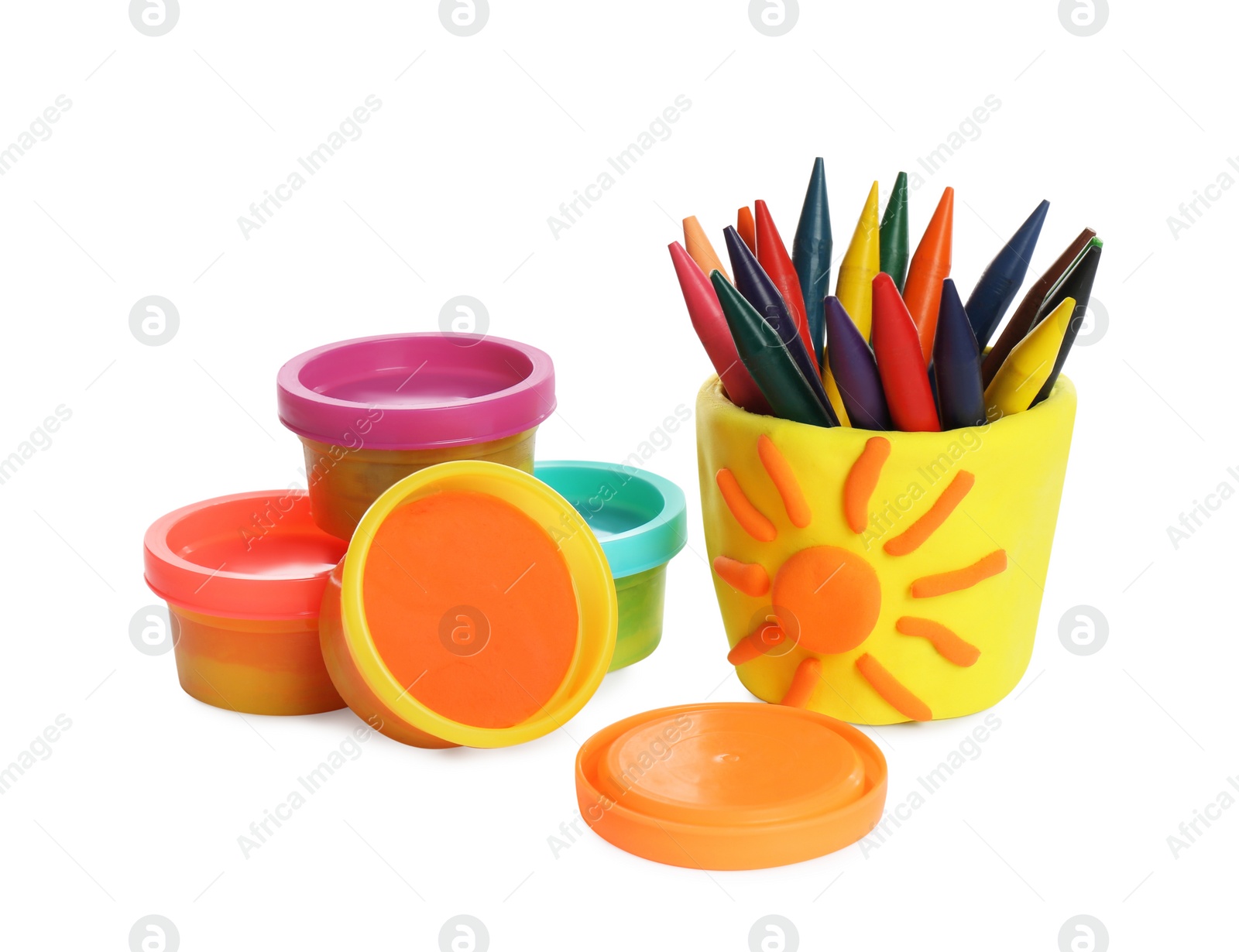 Photo of Set of bright play dough with colorful pencils on white background